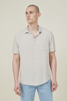 The cuban short sleeve shirt is a staple for your shirts collection. Features a loose fit, button front, chest pocket and short sleeves.

Features:  
- front chest pocket - loose Fit - Classic button up shirt style - Short sleeves - collar Summer Short Sleeve Camp Shirt With Placket, Spring Short Sleeve Shirt With Welt Pockets, Collared Short Sleeve Shirt With Pockets For Summer, Summer Button-up Shirt With Welt Pockets, Casual Solid Color Short Sleeve Shirt With Buttons, Casual Solid Short Sleeve Shirt With Button Closure, Solid Color Short Sleeve Shirt With Button Closure, Solid Short Sleeve Shirt With Button Closure, Summer Button-up Short Sleeve Shirt