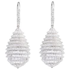 18 Karat White Gold 7.41 Carat Baguette-Cut Diamond Drop Cocktail Earrings This is a transformative and an articulate visionary diamond drop earring. The earring design is inspired from the in-famous Fraser fir tree. The tree's needles/pines are incredibly made with identical baguette and tapered cut diamonds held together by intertwined white gold prongs on either side floating one over another creating this beautiful merry look of the tree. This unreal use of diamond baguette forming full circ Luxury Baguette Cut Diamond Earrings For Formal Occasions, Luxury Formal Baguette Cut Diamond Earrings, Luxury Platinum Diamond Earrings With Baguette Diamonds, Luxury Platinum Baguette Diamond Earrings, Luxury Diamond Earrings With Baguette Cut, Luxury Baguette Cut Diamond Earrings With Accents, Luxury Baguette Cut Diamond Earrings, Luxury White Gold Baguette Cut Diamond Earrings, Luxury Diamond Earrings With Pave Setting For Evening