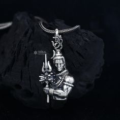 Metal-sterling silver. Item type-maha deva pendant Weight-10.44grams. Length-4cm, Width-1.8cm.  Finish-Oxidized. chain width-1.5mm(if buy) Weight-12.500 to 18.500 grams(weight vari as per length) Chain type-screw chain. Sterling Silver Amulet Necklaces For Puja, Sterling Silver Amulet Necklace For Puja, Sterling Silver Necklaces With Oxidized Finish For Puja, Sterling Silver Temple Jewelry For Meditation, Spiritual Carved Sterling Silver Jewelry, Spiritual Carved Jewelry For Puja, Silver Amulet Necklaces For Puja, Sterling Silver Pendant For Puja, Sterling Silver Locket For Puja