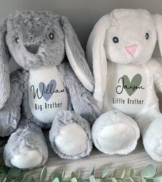 three stuffed animals sitting next to each other