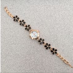 Nwot Gold Black Floral Watch/Bracelet Brand New, Never Used Battery Intact/Working Super Cute And Goes With Every Outfit! Black Metal Watch As A Gift, Black Metal Watches, Black Party Watches, Trendy Black Watch For Gift, Trendy Black Watch As A Gift, Trendy Black Watch For A Gift, Trendy Black Party Watches, Black Round Watch With Bracelet Strap, Black Round Bracelet Strap Watch