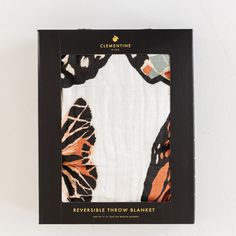 a box with an orange and black butterfly print on it