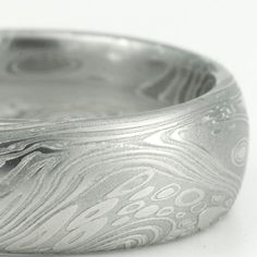 One of my favorite Damascus patterns!  Damascus Steel Mens Wedding Band 8mm.  Mokume Gane at its best! White Carved Rings For Wedding, Carved White Rings For Wedding, Silver Wedding Rings With Engraving Option, White Carved Wedding Rings, Carved White Wedding Rings, Modern Engraved Jewelry For Wedding, Elegant Wedding Rings With Brushed Finish, Modern Silver Engraved Wedding Ring, Silver Wedding Rings With Brushed Finish