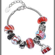 Beautiful Charm Bracelet Features Red And White Murano Glass Beads, Rhodium Plated Stainless Steel Carved Charm Beads, And The Beautiful Red Purse Dangling Charm. The Bracelet Is A Sleek Snake Stain Which Is Also Made Of Rhodium Plated Stainless Steel. It Is Approximately 7 Inches Long With A 1.5 Inch Extender. There Is A Lobster Claw Clasp. Elegant Beaded Bracelets For Holidays, Elegant Beaded Bracelet For Holidays, Elegant Beaded Holiday Bracelet, Nickel-free Red Beaded Bracelet As Gift, Elegant Charm Bracelet With Colorful Beads As Gift, Metal Jewelry With Large Beads For Gift, Elegant Silver Beaded Bracelets With Colorful Beads, Metal Jewelry With Large Beads As Gift, Elegant Red Crystal Bracelet As Gift