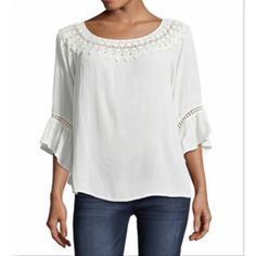 The Textural Crepon Knit Fabric Adds Flair To This John Paul Richard Solid Peasant Top With Crochet Yoke Detail Around The Scoop Neck And Sleeves. Features Include 3/4 Bell Sleeves And A Shirt Tail Hem.. Casual Fall Blouse With Crochet Trim, Casual Blouse With Crochet Trim For Fall, Casual Crochet Trim Blouse For Fall, Fall Crochet Trim Tops For Day Out, Spring Brunch Tops With Crochet Trim, Casual Blouse With Crochet Trim For Day Out, Spring Crochet Trim Top For Brunch, Chic Blouse With Crochet Trim For Brunch, Lace Insert Top