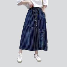 Be the envy of everyone in the 2023 Spring-Summer Collection with this stylish long denim skirt! With its distinctive vertical stripes and high-waisted fit. this skirt is sure to make a statement. Featuring a drawstrings closure. it's the perfect combination of comfort and flair. Whether you're headed to a music festival or a laid-back day out with friends. this skirt will become the crowning jewel of your outfit!Key Highlights: Street Style: This skirt is the perfect blend of contemporary fashi Striped Cotton Relaxed Skirt, Relaxed Striped Skirt For Spring, Striped Summer Skirt, Casual Striped Cotton Skirt, High Waist Striped Summer Skirt, High Waist Striped Skirt For Summer, Cotton Long Skirt With Drawstring, Summer High Waist Striped Skirt, Casual Cotton Skirt With Vertical Stripes