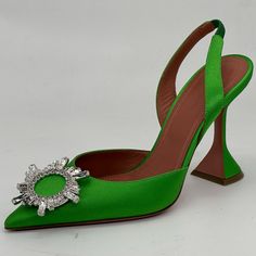 Amina Muaddi’s Begum Slingback Pumps Are Styled With A Pointed Toe And A 95mm Sculptural "Martini" Heel. Crafted Of Satin, This Pair Features A Crystal Brooch Adornment. Satin Upper Pointed Toe Slingback Strap Leather Lining Leather/Rubber Sole Made In Italy Designer Color: Shamrock Size 40 Eu (Insole Measures Approx. 10.75"). Brand New Inthe Box With A Signature Dust Bag Green High Heel Slingback Pumps With Padded Heel, Green High Heel Slingback Pumps With Strap, Green Slingback Sandals With Heel Strap For Evening, Green Closed Toe Slingback Pumps For Party, Luxury Green Slingback Pumps, Green Slingback Pumps With Open Heel, Cocktail Slingback Pumps With Sculpted Heel, Green Open Toe Slingback Pumps For Evening, Green High Heel Slingback Sandals With Padded Heel