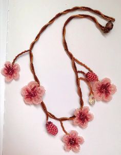 The one of a kind asymmetrical beaded cherry blossom necklace, 100% designed and hand-crafted by me! This 40 cm unique, artisan jewelry is meant to look exactly like the magnificent spring cherry blossom branches so you can wear one on your neck and look like an ethereal nymph! It is entirely made with premium quality miyuki glass beads that they are known to made exclusively in Japan and are considered one of the most refined, luxurious tiny beads in the world! You will not wear a simple necklace. This is a piece of art made with thought, care, love, and the highest quality materials. In the personalization section, you can type the length you prefer as well as your own adjustments regarding the style of the necklace. *Its piece is slightly different from the original one as this design i Pink Bohemian Necklace With Flower Charm, Handmade Delicate Flower Beaded Necklaces, Bohemian Pink Necklace With Flower Charm, Handmade Delicate Flower Beaded Necklace, Delicate Handmade Flower Beaded Necklace, Pink Flower Pendant Necklace For Jewelry Making, Handmade Pink Flower Necklace, Handmade Adjustable Pink Necklace, Delicate Handmade Pink Flower Necklace