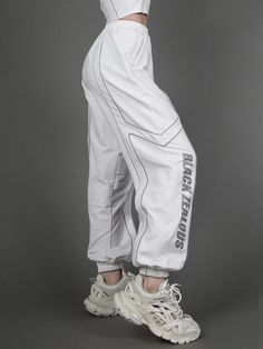 Features: It features loose sweatpants, high waist with elastic band, right hem with black zeous print decoration, reflective design.  Fabric: Polyester  Attention: This price includes a pair of sweatpants only, others are not included.  Size Chart(cm):   	 		 			Size(cm) 			S 			M 			L 		 		 			Waist 			56 			58.5 			61 		 		 			Hip 			107 			109.5 			112 		 		 			Sweatpants Length 			98 			99 			100 		 	   (Inevitable measurement error 2-3 cm.) Techwear Baggy Sweatpants For Streetwear, Baggy Techwear Sweatpants For Streetwear, Baggy Techwear Sweatpants, Cotton Sweatpants For Streetwear Hip Hop Style, Cotton Sweatpants For Hip Hop Streetwear, Cotton Hip Hop Sweatpants For Streetwear, White Hip Hop Pants With Cargo Pockets, Urban Baggy Joggers For Streetwear, Streetwear Sportswear Sweatpants With Elastic Waistband