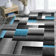 an area rug with blue and gray squares on it