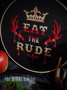 a cross stitch pattern with the words eat the rude and an apple next to it