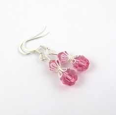 These beautiful pink earrings are created with rose pink Swarovski crystal element beads and beautiful silver bead caps. The earrings are composed of silver plated components. These pink drop crystal earrings are lightweight and great for anyone who loves pink. They come in a cute organza bag. See the matching necklace via the link below. LENGTH: about 1 & 1/2 inches total (top of ear wire to end of lowest bead) Matching pink bead necklace: https://www.etsy.com/listing/201854945/pink-necklac Elegant Pink Crystal Earrings With Round Beads, Pink Crystal Ear Wire Earrings For Gift, Handmade Pink Crystal Earrings, Handmade Pink Crystal Earrings In Sterling Silver, Pink Sterling Silver Crystal Earrings As Gift, Handmade Pink Crystal Sterling Silver Earrings, Pink Dangle Crystal Earrings With Faceted Beads, Elegant Pink Earrings With Faceted Beads, Pink Sterling Silver Beaded Earrings