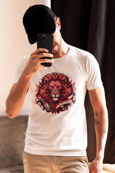 White T-shirt "Dima Maghreb" - Atlas Lions Proudly display your support for the Moroccan national team with this white "Dima Maghreb" T-shirt, featuring a bold design of the Atlas Lions, an iconic symbol of Moroccan football. Made from soft, comfortable cotton, this t-shirt offers a relaxed fit that's suitable for any occasion. The "Dima Maghreb" logo, stylized with the majestic lions, recalls the unity, pride and passion of Moroccan supporters. Ideal for match days, sporting events or to displa Moroccan National Team, Moroccan Football, Bold Design, Sport Event, White Tshirt, Morocco, Halloween Shopping, Lion, Gender Neutral