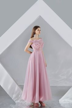 The dress offers a unique look with its cold shoulder sleeves and attached floral applique. The lightweight organza skirt offers a pleated design, creating a chic, elegant evening look. Tulle Evening Dress With Floral Applique For Party, Party Evening Dress With Floral Applique In Tulle, Floral Embellished Ball Gown Evening Dress For Party, Party Evening Dress With Floral Applique And Tulle, Floral Ball Gown Evening Dress For Party, Floral Applique Tulle Dress For Banquet, Floral Applique Ball Gown For Banquets, Floral Applique Ball Gown For Banquet, Formal Ball Gown With Floral Applique