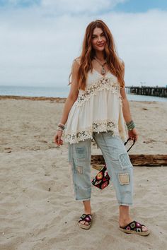 Fun, flowy, and unique—every boho gal's dream! The Catania Lace Trim Tunic Top is exactly what you've been looking for. Don't miss out! So pretty, intricate crochet fabric and contrast details throughout Relaxed and loose tank top silhouette Classic V - neckline and sleeveless design with thick tank straps Low V - backline with classic zipper back closure for comfortable fit Slight high - low crochet trim bottom edge with a rounded back edge for added boho style Pair with: Evermore Seamless Lace Bohemian Lace Top For Spring, Spring Bohemian Embroidered Lace Top, Bohemian Lace Crochet Top For Vacation, Bohemian Lace Top For Beach In Spring, Summer Cotton Lace Top With Lace Patchwork, Spring Lace Patchwork Top For Festivals, Summer Beach Lace Top With Crochet Trim, Bohemian Lace Patchwork Top, Spring Festival Lace Patchwork Top