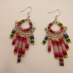 Earrings For Women In A Collected Old Blanket Were Made By Peruvian Artisans From Cusco, Using Old Handmade Blankets With Natural Pigments. Due To The Polychromy Or Variety Of Colors, Coloring Techniques, Weaving And Applications, And With The Fine Fibers Used. These Earrings Are Handmade By Peruvian Artisans From The Andean Community Of Cusco. Multicolor Handwoven Bohemian Earrings, Festive Multicolor Beaded Earrings With Latkans, Bohemian Multicolor Handwoven Earrings, Fair Trade Beaded Dangle Earrings, Multicolor Beaded Earrings With Latkans As Gift, Adjustable Multicolor Bohemian Hoop Earrings, Bohemian Pink Earrings With Latkans, Bohemian Rainbow Hoop Earrings, Rainbow Bohemian Hoop Earrings