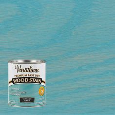 a can of vartave premium fast dry wood stain on a blue wooden background