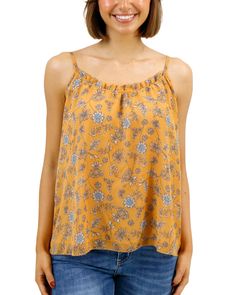 Yellow Floral Cami Beautiful and flowy, the new Mustard Floral Ruffled Swing Cami brings an easy elegance to your cool weather style! This flowy cami top features a warm yellow floral print with soft pops of blue and cream that are sure to brighten up any fall day. The swingy silhouette and dainty ruffle along the neckline make this cami top a comfortable, flattering, new favorite go-to for the season! Why you’ll love it: Flowy spaghetti strap mustard floral cami top with feminine, swingy silhou Flowy Cami Top, Floral Cami Top, Grace And Lace, Floral Cami, Warm Yellow, Pullover Cardigan, Fall Day, Short Leggings, Kimono Jacket