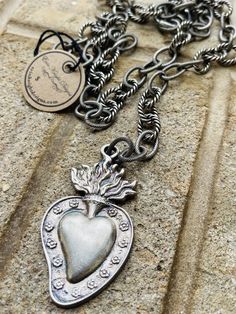 https://s3.commentsold.com/rush/products/O9zE9tHTLGxOih4nIcFjrY0bJM7aVQLDgjXPSXax.jpg Heart-shaped Necklace With Vintage Charm, Bohemian Silver Heart Necklace, Sterling Silver Heart-shaped Chain Jewelry, Vintage Metal Chain Necklace With Heart Pendant, Vintage Metal Heart Pendant Chain Necklace, Silver Vintage Heart Necklace With Charm, Vintage Sterling Silver Heart Charm Necklace, Silver Heart Charm Chain Necklace With Heart Pendant, Silver Sterling Silver Heart Necklace