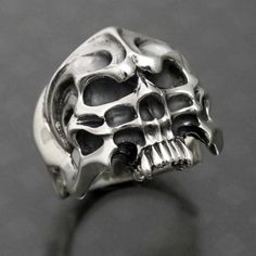 made by Strange Freak Designs SFD-R-014 creature skull ring. half skull made in JAPAN if you want other ring gauge please contact us. Gothic Silver Skull Ring, Collectible Gothic Skull Ring, Unique Skull Ring Collectible, Symbolic Hand Cast Skull Ring, Gothic Skull Collectible Rings, Gothic Skull Rings For Collectors, Silver Punk Skull Ring, Collectible Gothic Silver Skull Ring, Silver Gothic Skull Ring Collectible