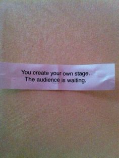 a piece of pink paper with a quote on it that says, you create your own stage the audience is waiting