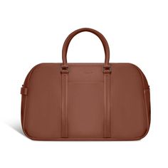 This Champs leather duffle bag from the Onyx Collection is the perfect travel accessory for a weekend get-away. Features removable and adjustable shoulder straps, easy carry top handles, a trolley strap with back zipper pocket, and an inner RFID zipper pocket for extra security. The convenient side carry handle and the purse feet allow you to put down your bag without fear of damage. Dimensions: 20 in. x 12.5 in. Color: Brown. Leather Duffle Bag, Luggage Backpack, Leather Duffle, You Bag, Travel Accessories, Backpack Bags, Shoulder Straps, Zipper Pocket, Duffle Bag