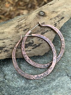 These hoops are perfect for everyday wear. They are hand forged from pure, organic copper a hand textured with a unique pattern. These earrings have a rustic, oxidized finish. The hoops in the photos are available to ship immediately.  MEASUREMENTS & SPECIFICS: WIDTH: approx 4mm thickness tapered to about 2mm DIAMETER: inner diameter is approx 3.5cm METAL: PURE ORGANIC COPPER w/ 925 STERLING SILVER POSTS FINISH: oxidized copper TEXTURE: rustic / cement texture All jewelry from my studio carries Artisan Electroformed Hoop Earrings, Hammered Copper Round Hoop Earrings, Handmade Copper Round Hoop Earrings, Artisan Bronze Copper Hoop Earrings, Artisan Hand Forged Round Hoop Earrings, Electroformed Metal Hoop Earrings, Unique Small Hoop Copper Earrings, Artisan Small Hoop Copper Jewelry, Hammered Copper Hoop Jewelry