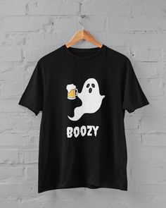 Halloween Ghost Crewneck T-shirt, Funny Boozy Ghost, Cute Fall Ghost Clothing, Halloween Party Shirt, Vintage Retro Halloween Ghost Shirt Funny Boozy Ghost Halloween T-Shirt MATERIAL AND SIZING *Gildan sweatshirts and hoodies come in unisex sizes *Our sweatshirts and hoodies are high quality, soft and comfortable. They are made with top-of-the-line vinyl and pressed with a professional heat press.  *Made with 100% cotton RETURN AND REPLACEMENT POLICY *Please check our size and color chart before Casual Crew Neck T-shirt For Costume Party, Novelty Short Sleeve T-shirt For Costume Party, Spooky Letter Print T-shirt For Costume Party, Novelty T-shirt For Costume Party With Short Sleeves, Novelty T-shirt For Costume Party, Halloween Crew Neck Top With Funny Text, Ghost Shirt Design, Ghost Tshirts, Ghost Crewneck