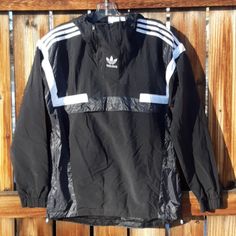 Brand New With Tags Adidas Black Windbreaker Jacket Mens Size Small 2 1/4 Zippers On Top Mesh Lined Interior Has Zippers On Sides Of Jacket Black Half-zip Track Jacket For Outdoor, Black Half-zip Windbreaker For Outdoor Activities, Black Half-zip Winter Track Jacket, Black Half-zip Techwear Windbreaker, Black Half-zip Nylon Track Jacket, Black Half-zip Techwear Outerwear, Black Nylon Half-zip Track Jacket, Sporty Black Half-zip Outerwear, Black Half-zip Windbreaker For Winter