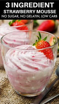 two small bowls filled with whipped cream and strawberries on top of burlly cloth