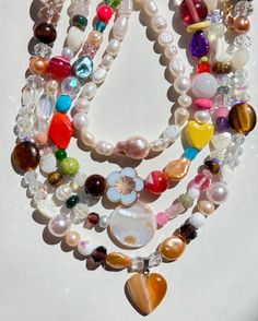 Fixing our sweet tooth with these Organic BONBON Candy Necklaces! This special series is handmade with all semi-precious and precious stones such as natural agates, tiger’s eye gemstone, mother of pearls, and vintage glass beads we collect over the years. We will add new pieces from time to time! Limited quantities for these healthy "sweets" (Not actually edible, of course). All necklaces measure at about 16" long with a gold-plated circle clasp. Chunky Bead Necklaces Aesthetic, Clutter Necklace Y2k, Cool Pearl Necklace, Cool Beaded Necklaces, Maxamilist Jewelry, Glass Beaded Necklace, Hsr Redesign, Craft Moodboard, Chunky Beaded Necklace