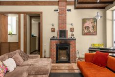 a living room filled with furniture and a fire place