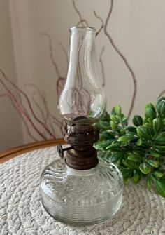 a glass bottle sitting on top of a table