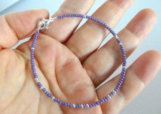 Purple bracelet, purple and silver beaded bracelet, seed bead bracelet, dainty purple bracelet, anklet, ankle bracelet, violet, one strand❤ SIZESThis item comes in several sizes. Kindly choose at checkout. The standard size for an average woman is 7”. For a child, a 6” would be appropriate. I recommend you measure your wrist to determine the best fit.❤ PROCESSING AND SHIPPINGMost orders are made and shipped out in one business day. Please check delivery timeframes for your location on the descri Bridal Party Bracelets, Bracelet Violet, Average Woman, Nugget Bracelet, Silver Beaded Bracelet, Gray Bracelet, Blue Beaded Necklace, Purple And Silver, Purple Bracelet