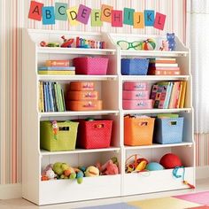 the kids's room is organized with toys