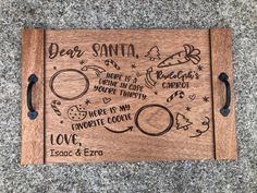 a wooden plaque with writing on it that says dear santa