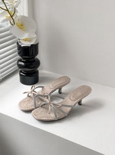 Be the ultimate good girl with Keziah Bow Sandals. These beige sandals feature a romantic bow detail and vintage style that will elevate any outfit. Made from genuine leather, the Keziah Bow Sandals offer both comfort and durability. The low heel, ranging from 3 to 5 cm, ensures ease of wear throughout the day, making them perfect for any occasion. Their vintage charm and feminine design make them a standout piece in any wardrobe. Step into the Good Girl Things Shoes & Bags Collection and add so Summer Beige Low Heel Kitten Heels, Beige Low Heel Kitten Heels For Summer, Beige Closed Toe Kitten Heels For Summer, Beige Kitten Heels For Summer, Summer Beige Kitten Heels With Round Toe, Beige Round Toe Kitten Heels For Summer, Beige Kitten Heels With Round Toe For Summer, Cream Kitten Heels For Summer, Summer Cream Leather Kitten Heels