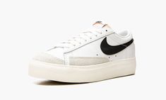 The Women’s Nike Blazer Low Platform “White/Black” is a women’s version of the vintage basketball shoe in a timeless colorway that features a raised platform sole.  The casual and versatile Blazer Low Platform is an everyday-wearing style that brings a retro look to an outfit, and adds height to the wearer with its stacked midsole.  The upper features a white leather base with contrasting light grey suede overlays on the toe and forefoot.  A black leather Swoosh resides on either side and black Raised Platform, Sneaker Outfits Women, Nike Blazer Low, Sneaker Outfits, Vintage Basketball, Womens Blazer, Blazer Low, Wearing Style, Nike Brand