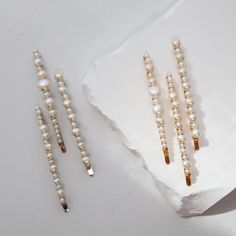 Choose between three styles. Classic pearls arranged in a minimal cluster on a simple barrette. Wear in a tousled half up-do, tame fly-aways under a topknot, or adorn hair pulled sleekly back. Available in silver or gold. Pearls are a natural material with variations and are carefully hand selected for each barrette. SIZE Each barrette is 3 ⅜" long. The pearls are between 3mm and 11mm wide. MADE TO ORDER Our current production time on all items varies. If you need the item sooner than the indicated processing time, please inquire. MADE WITH LOVE IN DOWNTOWN LOS ANGELES, CALIFORNIA. Bridal Hair Barrettes, Pearl Barrette, Hair Pulling, Half Updo, Pearl Hair Pins, Bridesmaid Accessories, Pearl Cluster, Bridal Hair Pins, Real Pearls