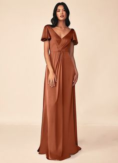 a woman in a long brown dress