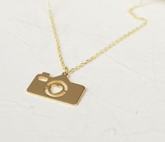 14k Solid Gold Tiny Camera Charm Necklace with Heart, Minimalist Photographer Jewelry, Dainty Camera Pendant, Christmas Gift for Traveler ♡ PRODUCT FEATURES ♡  * Material Selection: Sterling Silver, 14K Solid Gol * Color Selection: Yellow Gold, White Gold, Rose Gold * Necklace Lengths: 14 inches, 16 inches, 18 inches, 20 inches * Pendant Size: 8x12 mm * In addition to 14" -16" - 18" necklace lengths, it is possible to add +3 cm to silver products. (as adjustable)  ♡ OTHER ∙ FEATURES ✓ Anti-aller Camera Pendant, Heart Minimalist, Camera Charm, Tiny Camera, Gift For Traveler, Necklace With Heart, Material Selection, Diamond Choker, Jewelry Dainty