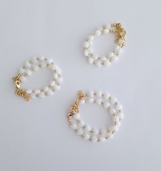 "If you would like to add gold filled hardware to a bracelet, please use this link to purchase it along with the bracelet. You will need to purchase one for EACH bracelet you would like to add gold filled hardware to. https://www.etsy.com/LittleLovliesShop/listing/860546443/gold-filled-upgrade?utm_source=Copy&utm_medium=ListingManager&utm_campaign=Share&utm_term=so.lmsm&share_time=1598757365437 Mini Hearts Bracelet. Just like the other hearts bracelet, but these hearts are smalle White Heart Beads Bracelet For Weddings, White Faceted Beads Jewelry As Gift, Dainty Jewelry With Heart Shaped Round Beads, White Faceted Beads Jewelry For Gifts, Dainty Jewelry With Heart-shaped Beads, Dainty Jewelry With Round Heart Beads, Wedding White Heart Beads Bracelets, White Heart-shaped Beaded Bracelets For Wedding, Elegant White Beaded Heart Bracelet