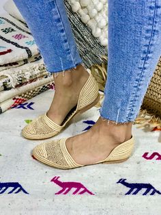 We fell in love with these lightweight shoes and now we want to share this love with you! The slippers are handcrafted in Morocco following old traditions. It takes one day to finish one pair of shoes: That's slow fashion! The upper material is made from palm leaves (raffia) and the sole is a structured rubber. The design is unique and furthermore super comfortable. We don't wanna take them off anymore. This style has additionally a closed heel part to give more stability. Made in Morocco. When Beige Closed Toe Slip-ons With Rubber Sole, Closed Toe Slippers For Spring, Summer Pointed Toe Slippers With Leather Sole, Handmade Casual Mules, Beige Slip-on Slippers With Closed Toe, Beige Closed Toe Flats With Textured Footbed, Beige Flat Slippers With Textured Sole, Beige Closed Toe Slip-on Slippers, Beige Slip-on Closed Toe Slippers