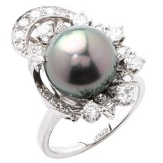 Fine 12mm Tahitian Pearl and Diamond ring. This gorgeous ring features a very fine 12mm Tahitian pearl surrounded by approximately 1.2 carats of mix cut diamonds. Ring Size: 7 (can be sized) Metal Type: 14Kt White Gold (stamped and/or tested) Metal Weight: 10.1 Grams White Gold Pearl Ring, Tahitian Pearl Ring, Pearl Diamond Ring, Gold Pearl Ring, Vintage Cocktail Ring, Tahitian Black Pearls, Pearl And Diamond Ring, Fine Diamond Jewelry, Gold Cocktail Ring