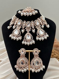 rose gold polish pearl uncut kundan choker set with tikka x earrings.  lightweight earrings  Style tip- ----------- Pair it with any beautiful traditional outfits  and flaunt with Unique style of collection from us. Perfect match for Festival and Traditional wear.  Take Care Tips-  ---------------- Kee away from perfume, Hair spray and. Moisture.  Store in dry place , Ziplock bag or Airtight box.    Clean with dry cloth.  Jewellery is the last thing you should wear and first thing you should rem Festive Rose Gold Bridal Necklace, Festive Rose Gold Chandbali Jewelry, Rose Gold Chandbali Jewelry For Wedding, Rose Gold Chandbali Wedding Jewelry, Traditional Rose Gold Jewelry Sets For Wedding, Rose Gold Choker For Wedding, Rose Gold Wedding Choker Jewelry, Cloth Jewellery, Kundan Choker Set