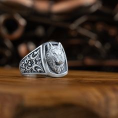 "Alpha Wolf men signet ring, Handmade wildlife cool jewelry for animal lover gift, Wolf ring in sterling silver for husband  Alpha wolves have long been admired for their strength, confidence, and leadership. In the wild, they are responsible for leading their pack to success through hunting, protecting, and providing for the group.Alpha wolf. It described the top dog that clawed its way to the top of its pack, and it quickly became a mainstream symbol for power and dominance. \"Alpha\" status i Silver Ring With Wolf Design, Silver Wolf Design Ring As Gift, Wolf Design Ring Jewelry Gift, Wolf Design Ring Jewelry For Gift, Symbol For Power, Men Signet Ring, Wolf Ring, Alpha Wolf, Local Jewelry