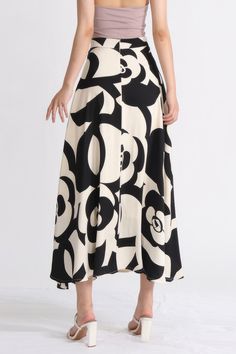 This Patterned Midi Skirt features a contrast floral pattern to make a statement and its lightweight material is delicately pleated around a comfortable waistline with zipper closure.Fabric: Cotton, Polyester Patterned Midi Skirt, Midi Skirt Pattern, Black Midi Skirt, Swimwear Cover Ups, Swimwear Cover, Swimwear Tops, Fabric Cotton, Floral Pattern, Midi Skirt