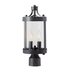 a light fixture with two candles in it on a white background and black metal frame