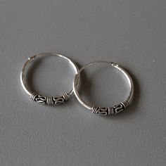 Delicate minimal sterling silver jewelry. Our products are made with 925 sterling silver and are hypoallergenic and nickel free! This listing is for a PAIR of hoops.  ✨ Hoop dimensions 18mm outer diameter, 16mm inner diameter  1.2mm thickness ✨ Material 925 sterling silver  🎁 Every order comes in a cute jewelry box ready to gift.🇹🇭 We ship from Bangkok, Thailand. 🤩 Flat shipping rate, add more products and shipping cost stays the same! 🌎 All orders ship with a tracking number. 😍 USA orders Adjustable Classic Hoop Earrings In Sterling Silver, Classic Adjustable Sterling Silver Hoop Earrings, Adjustable Classic Sterling Silver Hoop Earrings, Silver Sterling Hoop Earrings With Simple Design, Simple Sterling Silver Hoop Earrings, Simple Adjustable Sterling Silver Hoop Earrings, Cute Gift Boxes, Cute Gift, Jewelry Earrings Hoops