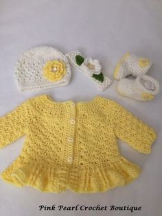 a crocheted baby outfit and booties are shown